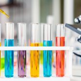 scientist with equipment and science experiments, laboratory glassware containing chemical liquid for research or analyzing a sample into test tube in laboratory.