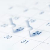 Tacks On Calendar Page/Business Concept